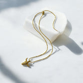 Collar de Acero Bañado en Oro con Dije de Toro y Circones