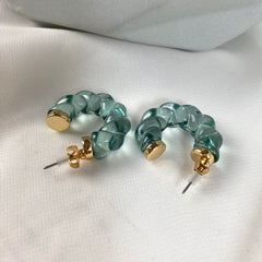Aretes argollas acrílicas twist celeste