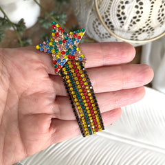 Aretes estrellita fugaz cristales rojo, amarillo, negro, verde