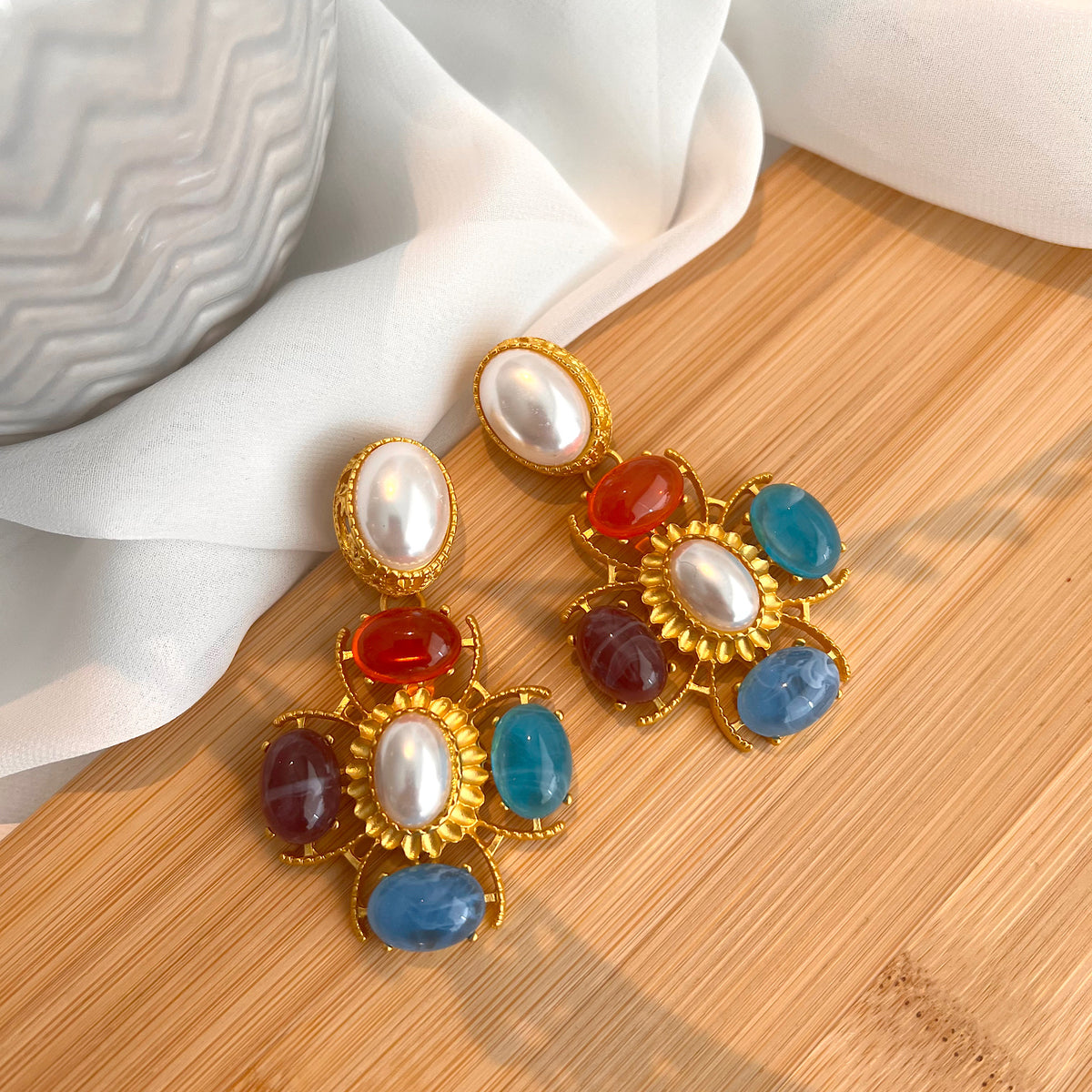 Aretes mikonos celeste, salmón, perla, dirado, lila