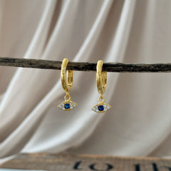 Mini argollas con dijes eyes en plata 925 enchapada en oro 18k