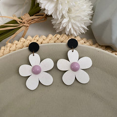 Aretes flower blanco